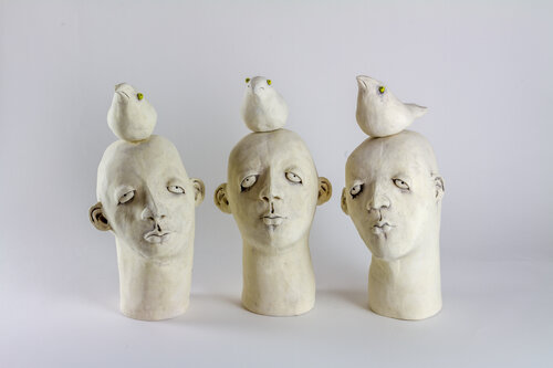 sculptural earthenware white heads