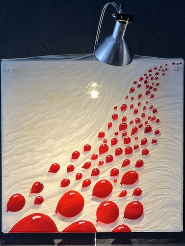 fused glass mosaic of balloons on a white background