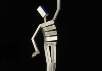 Stainless steel sculpture balancing primary colored balls by James Moore