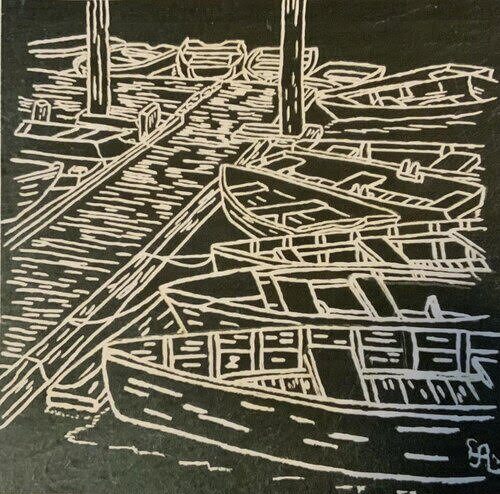 boat themed line art on slate