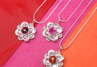Handcrafted blossom pendants in silver and gemstones