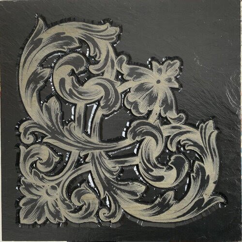 carved bas relief slate in scroll pattern