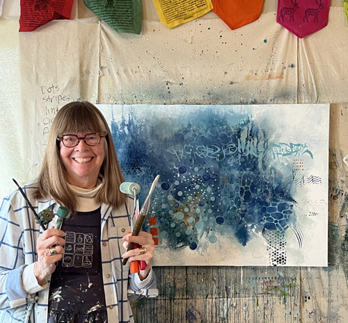 Artist and her painting in the studio