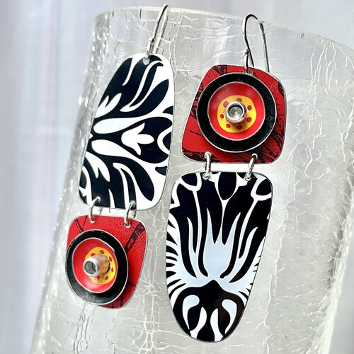 Boldly designed earrings made with upcycled tin