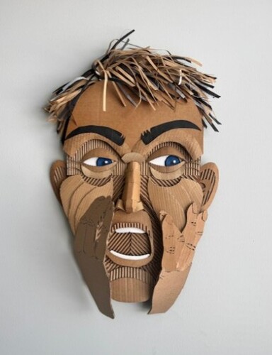 humorous cardboard and mixed media paper sculpture of a man