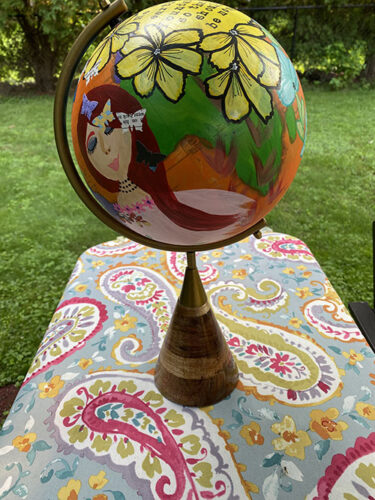 painted globe with whimsical figurative art