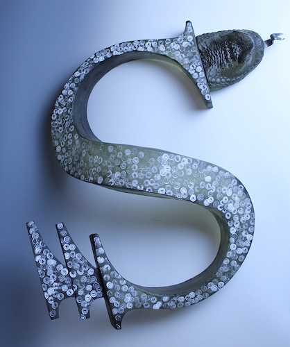 mixed media sculpture of the letter S