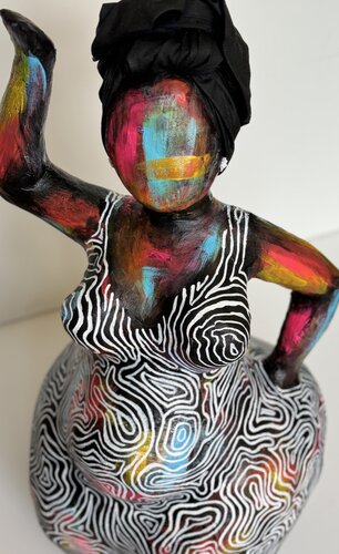 sculpture papier mache of an African American woman in a dress
