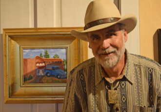 plein air artist Jack MacGowan with his painting