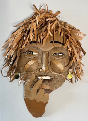 cardboard and upcycled materials wall sculpture of a woman