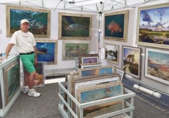 Artist Keith Martin Johns in his art show booth