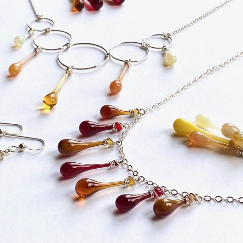 collection of glass teardrop necklaces