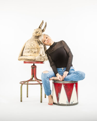 Ceramic artist shown with her sculpture
