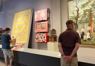 two men viewing art in a gallery