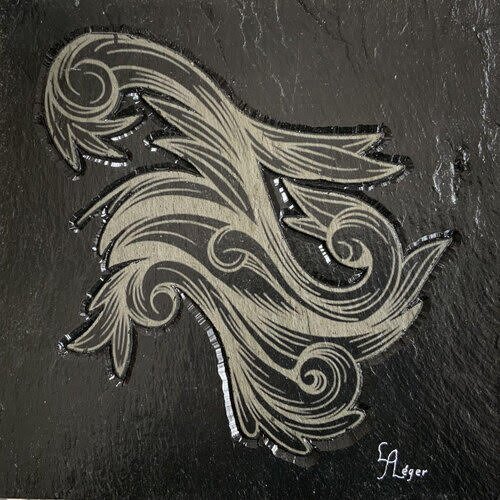 modern scroll design on bas relief slate