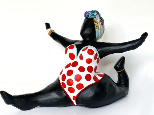 Sculpture of an African American woman doing a split