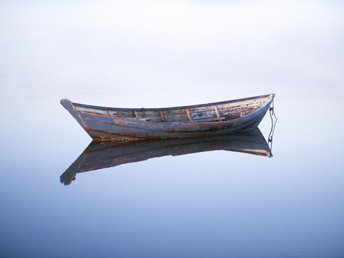 fine art photo of a lone dory on calm water