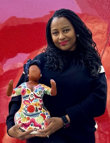 Artist Tina G. Vincent with her sculpture