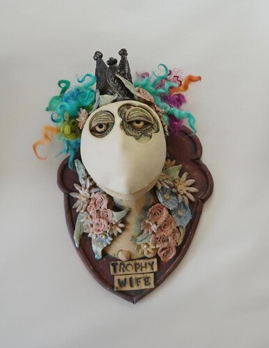 mixed media sculpture of a trophy wife