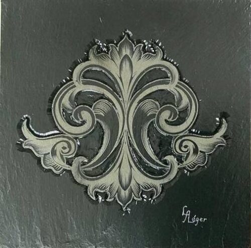 scroll design in carved bas-relief slate stone