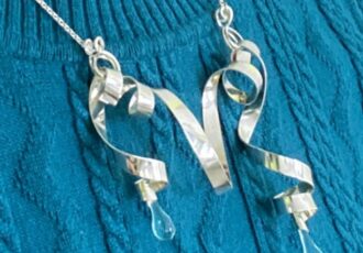 asymmetric handmade necklace of silver and glass