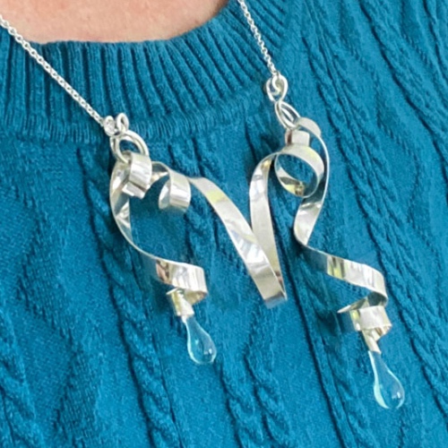 asymmetric handmade necklace of silver and glass