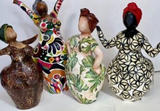 group of papier mache sculptures of African American woman